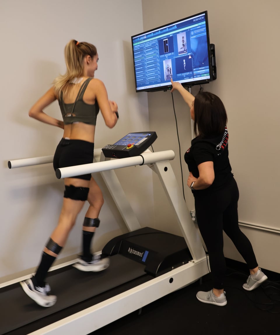 Patient on pressure-mapping treadmill with sensors